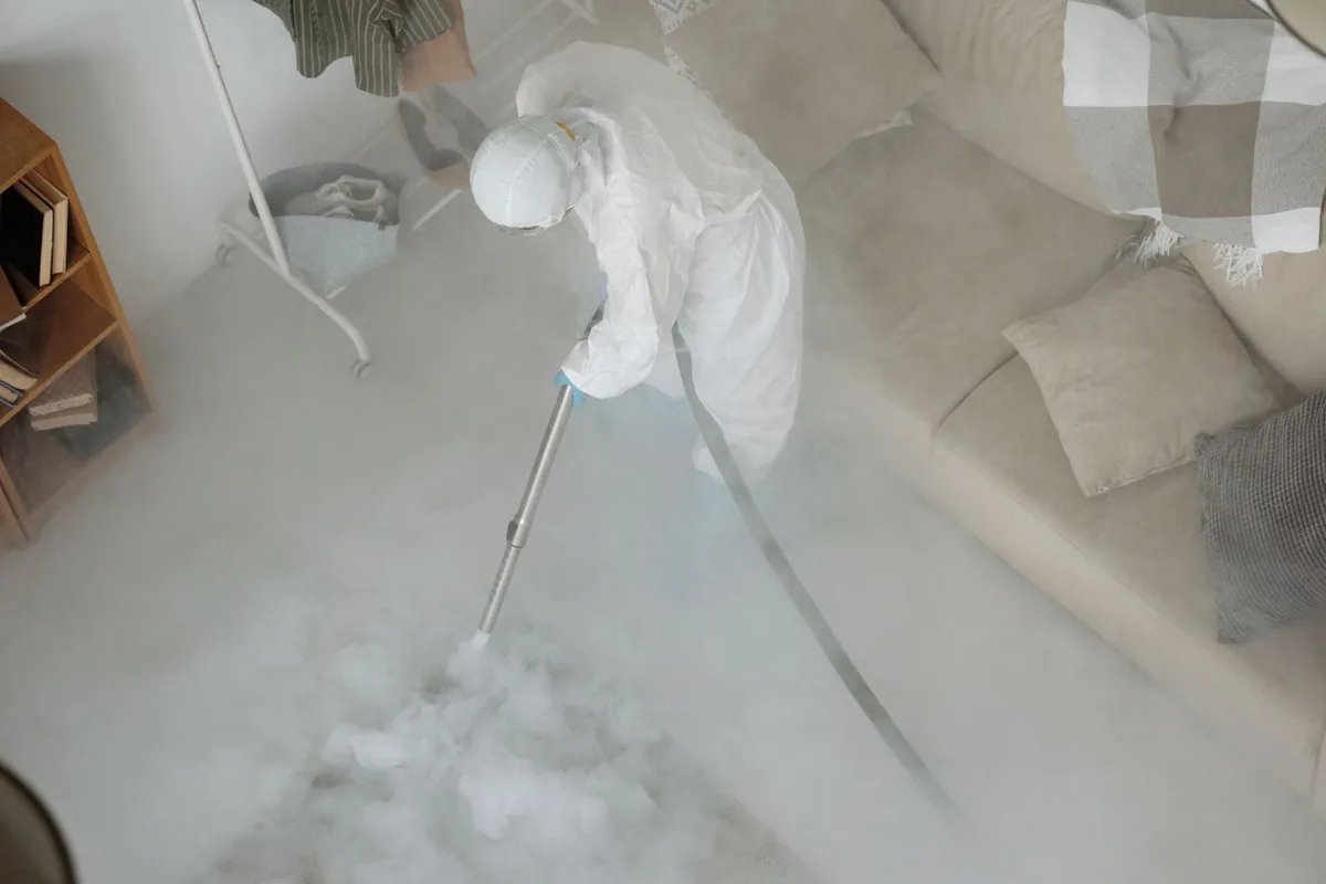 Biohazard cleanup technician in protective equipment, Madison, FL